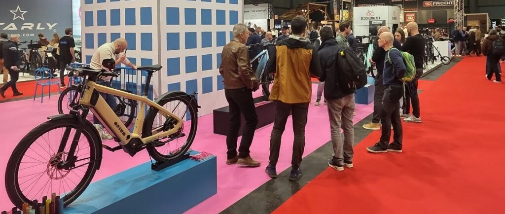 The Opium stand at Velofollies 2026 in Kortrijk, with a Model C on display